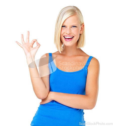 Image of Happy woman, portrait smile and OK sign for perfection, approval or satisfaction isolated against a white studio background. Blond female standing and showing okay hand gesture for good precision