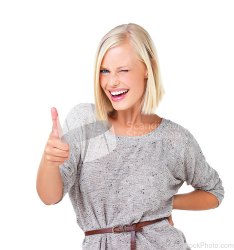 Image of Happy woman, portrait smile and thumbs up for good job, deal or well done isolated against a white studio background. Blond female standing and showing thumbsup hand gesture with wink for agreement