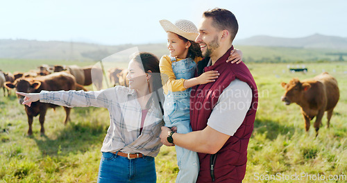 Image of Farm, cattle and family on holiday in the countryside of Argentina for a sustainable lifestyle in summer. Mother, father and kid on the grass of a field for animal cows during a vacation in nature