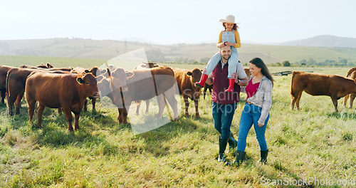 Image of Family, farm and agriculture with a girl, mother and father walking on grass in a meadow with cows. Farmer, sustainability and field with a man, woman and daughter working together in cattle farming