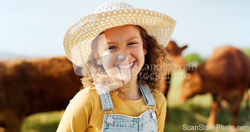 Image of Happy little girl, portrait smile and farm with animals enjoying travel and nature in the countryside. Child smiling in happiness for agriculture, life and sustainability in farming and cattle