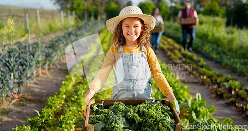 Image of Little girl, farm and agriculture in green harvest for sustainability, organic and production in nature. Portrait of child holding crops in sustainable farming in the countryside for natural resource