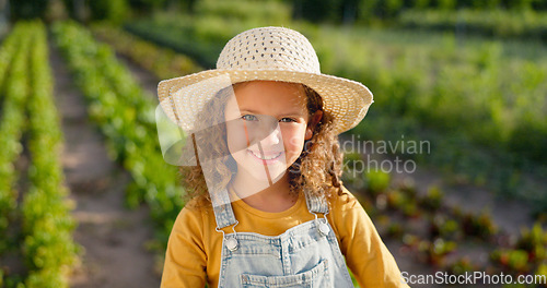 Image of Agriculture, portrait and girl child on farm ready to help with farming or harvest. Sustainability, agro and happy little girl or kid in straw hat on land learning how to plant vegetables or plants.
