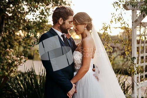 Image of Wedding, love and bride with groom in garden for marriage, ceremony celebration and commitment. Romantic partners, trust and bridal couple hug, embrace and happy for romance, calm and peace in park