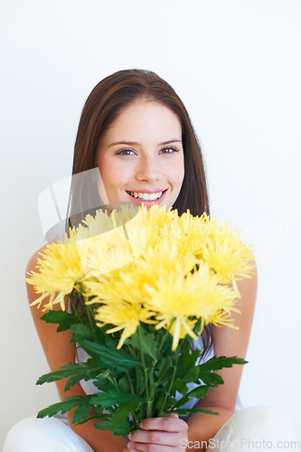 Image of Flower bouquet, face portrait and happy woman with floral studio product, sustainable gift or yellow present. Nature growth, spring beauty and eco friendly model girl isolated on white background