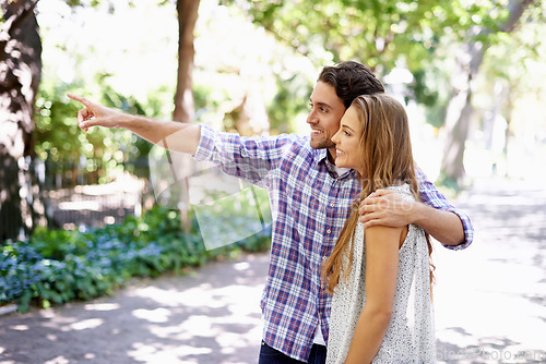 Image of Love, couple talking and in park for summer vacation, conversation and bird watching with happiness on Valentines day. Romance, man and woman in nature, walking and discussion with smile and loving