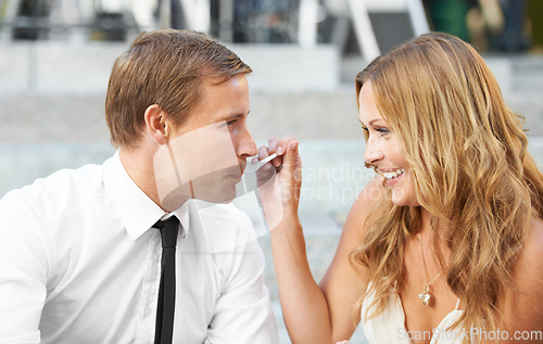 Image of Love, wedding and couple eating cake in city enjoying honeymoon, romance celebration and ceremony. Marriage, commitment and happy bride feed groom for romantic bonding, trust and affection outdoors