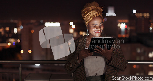 Image of Tablet, night and balcony with a business black woman doing research online while standing outdoor at her office. Working late, search and deadlines with a female employee doing overtime at work