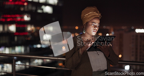 Image of Tablet, night and balcony with a business black woman doing research while working outdoor at her office. Finance, accounting and data with a female employee using an online search app outside