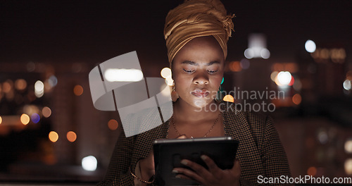 Image of Tablet, night and balcony with a business black woman doing research while working outdoor at her office. Finance, accounting and data with a female employee using an online search app outside