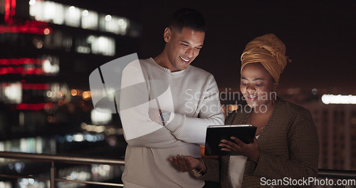 Image of Communication, night balcony and business people working, talking or review online social media feedback. New York city rooftop, teamwork collaboration and black woman discussion on digital marketing