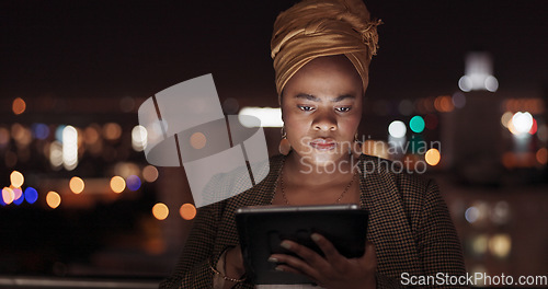 Image of Tablet, night and balcony with a business black woman doing research while working outdoor at her office. Finance, accounting and data with a female employee using an online search app outside