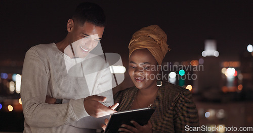 Image of Communication, night balcony and business people working, talking or review online social media feedback. New York city rooftop, teamwork collaboration and black woman discussion on digital marketing