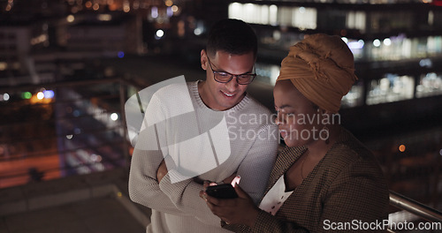 Image of Night, man and black woman with smartphone, connection and social media outdoor. Latino male, Nigerian female and cellphone for communication, share ideas and discussion late evening or online search