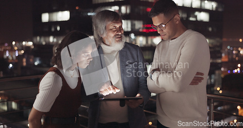 Image of Business team, tablet and night on city building rooftop talking global networking, digital marketing and social media. Man and woman with 5g network on mobile stock market app for innovation idea