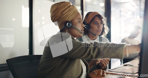 Image of Call center, training and black woman coaching recruit at customer service agency in Africa. Diversity, teamwork and crm, telemarketing manager consulting woman at desk for customer support help line