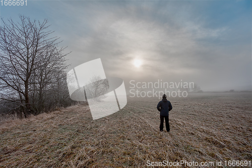 Image of men silhouette in the fog