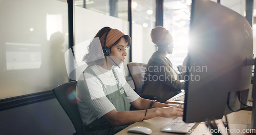 Image of Call center, computer and consulting with business woman for telemarketing, customer service and contact us. Communication, sales and crm with girl employee at help desk agency for technical support