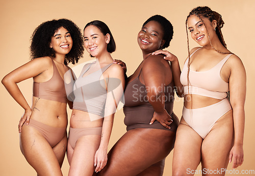 Image of Diversity, happy woman and body portrait of group together for inclusion, skin beauty and power. Underwear model friends on beige background for positivity, pride and motivation support for self love