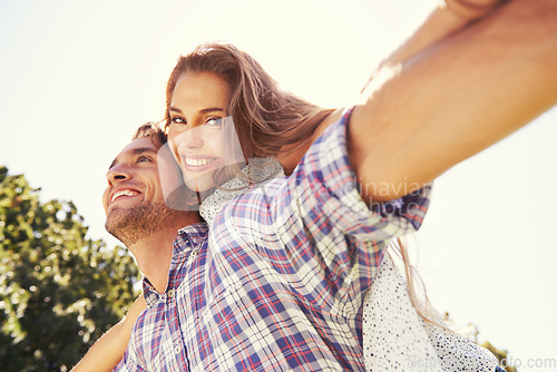 Image of Couple portrait, piggy back or airplane in nature park or low angle bonding on valentines day, garden date or romance love. Smile, happy or man carrying woman in aeroplane, fun game or freedom energy