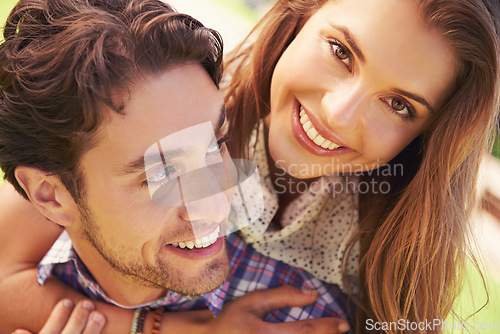 Image of Couple, portrait or piggyback face on romance date, valentines day or love bonding in park, garden backyard or nature. Zoom, smile or happy man carrying woman in fun game, freedom or energy support