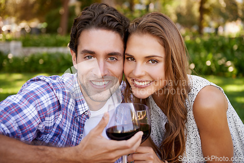 Image of Love couple, portrait or wine toast for picnic, valentines day or romance date bonding in nature park or garden. Smile, happy woman or man and alcohol drinks glass in marriage anniversary celebration