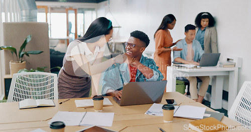 Image of Teamwork, laptop and business people fist bump in office for success celebration. Training, coaching and Asian woman teaching black man, support and advice while celebrating after solving problem.