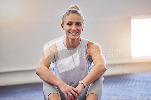 Image of Gym portrait, woman and workout of a happy athlete sitting with a smile ready for sports. Wellness, health and fitness club with a young person with happiness and health motivation for sport