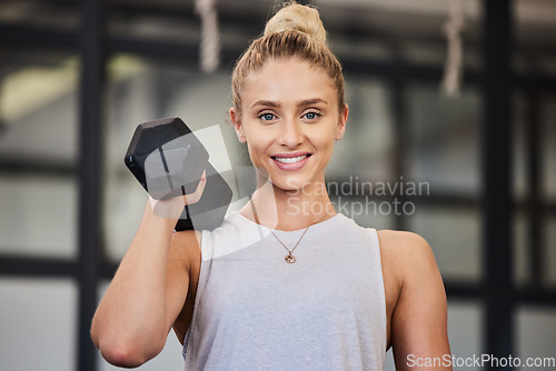 Image of Woman, dumbbell and gym portrait of a athlete with a smile ready for training, exercise and workout. Sports, happiness and young person bodybuilder in a health, wellness and sport center for body