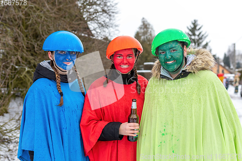 Image of Peoples in mask attend Masopust or the Mardi Gras carnival, traditional ceremonial door-to-door procession. 