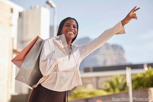 Image of Taxi, hand and sign by black woman shopping in a city, happy and smile on mockup background. Girl, hands and gesture for transportation service after retail or mall visit in town on the weekend