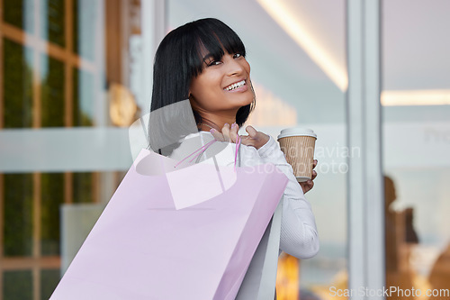 Image of Woman, shopping bag and portrait with coffee in mall, store and happiness of product sales. Rich customer, happy girl and retail gift bags of commerce market, discount promotion or luxury brand offer