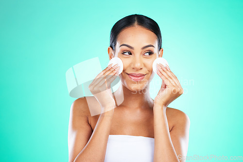 Image of Beauty, cleaning and woman thinking with cotton for skincare isolated on a green background. Mockup, routine and model with promotion of facial pads to clean face of makeup, product and dirt