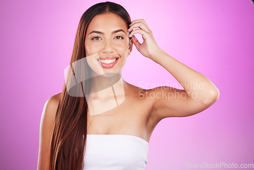 Image of Hair care, happy and portrait of a woman with beauty isolated on a pink background in a studio. Smile, salon and hairdresser model showing a hairstyle from a spa for grooming and brunette style