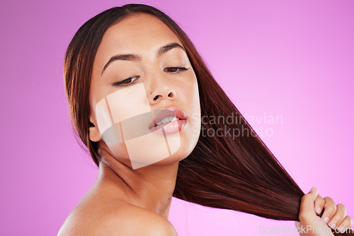 Image of Woman, face and strong hair in studio from keratin shampoo, texture and natural cosmetics in studio. Female model, growth and hairstyle with shine, aesthetic color and beauty glow on color background