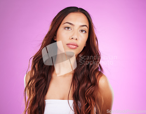 Image of Woman, beauty and portrait in studio for hair, shine and wavy textures, glow makeup and skincare. Young model, style with waves and natural cosmetics of salon, aesthetic color dye and growth shampoo