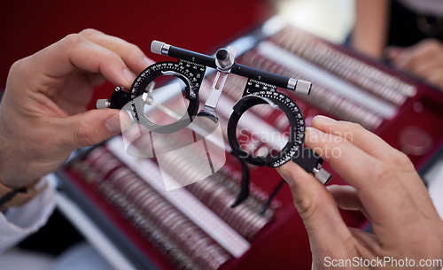 Image of Optometry, eyewear and lens for a optical test with a optometrist in a ophthalmology clinic or store. Optic, glasses and trial prescription spectacles for eye care, health and vision at a shop.