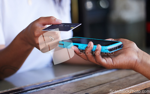 Image of Tapping, payment and hands with a credit card and machine to pay for a service at a coffee shop. Finance, contactless transaction and woman buying at a cafe, restaurant or shop with a waiter