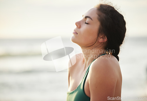 Image of Meditate, mockup and yoga by woman at the beach, sea and ocean for calm, peace and clear mind and soul. Zen, meditation and young female relax at shore for fitness, exercise and workout