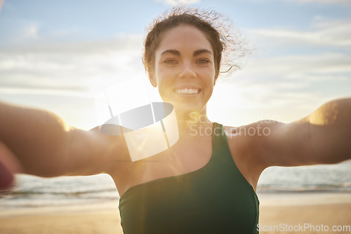 Image of Video call, fitness and woman on beach live streaming her workout, training or outdoor workout in social media blog. Selfie portrait of athlete, runner or cardio person or influencer journey by sea