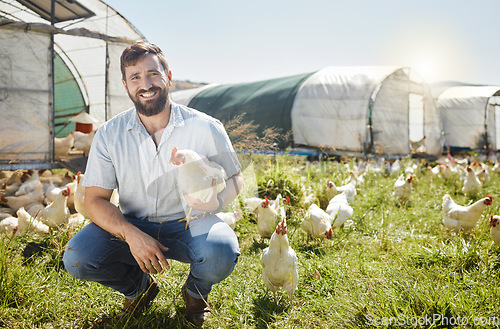 Image of Man on farm, chicken and agriculture with smile in portrait, poultry livestock with sustainability and organic with free range. Happiness, farming and environment, animal and farmer is outdoor