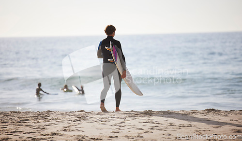 Image of Surfing on beach, man with surfboard for sports outdoor, ocean and travel with mockup space and nature. Adventure, extreme sports and athlete walking, active lifestyle with surf on sea waves in Miami