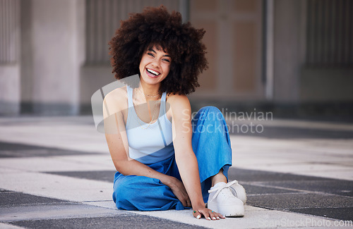 Image of Fashion, city and portrait of black woman on floor with trendy style, cool outfit and stylish clothes. Beauty, smile and happy girl sitting in urban building with confidence, happy attitude and pose