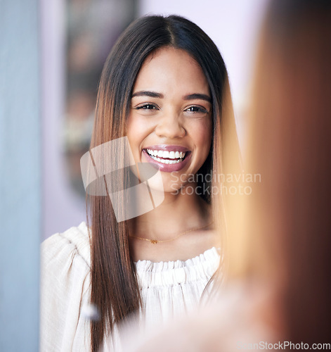 Image of Happy, smile and portrait of a woman in a mirror after doing her cosmetic, makeup or facial routine. Happiness, excited and face of a female model from Brazil with natural skin treatment at her home.