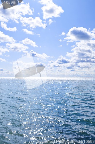 Image of Blue water and sunny sky background