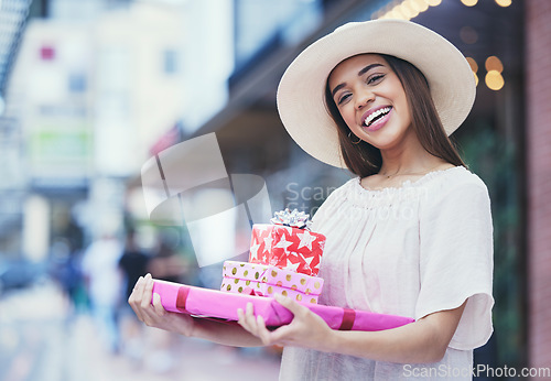 Image of Gifts, boxes and portrait of a woman in a shopping mall buying products for a party, event or celebration. Happy, smile and female purchasing presents for valentines day, anniversary or romance.