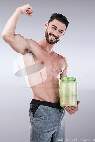 Image of Protein shake, fitness and health with portrait of man for workout, muscle and bodybuilder. Diet, gym and training with athlete and powder for sports, exercise and nutrition in gray studio background