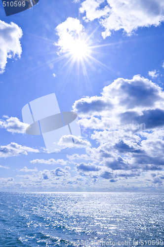 Image of Blue water and sunny sky background