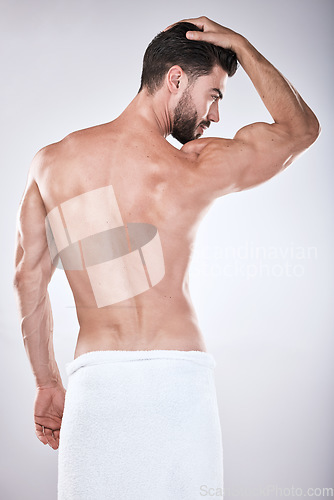 Image of Back, cosmetics and man cleaning, wellness and body care on grey studio background. Skincare, male or gentleman with dermatology, natural beauty and self care for hygiene, grooming or morning routine