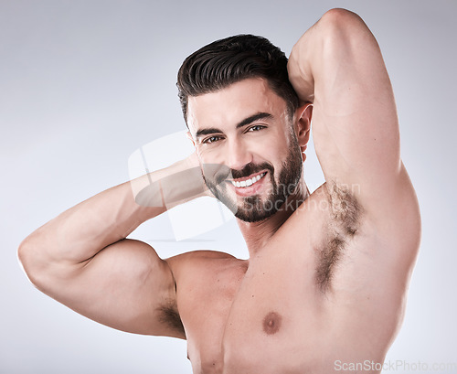 Image of Arm muscle, man and face with body in portrait, health and fitness with strong person isolated on studio background. Skin, bodybuilder and biceps, wellness and cosmetic care with growth with exercise
